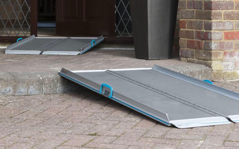 Folding ramps laid out leading to front door of house